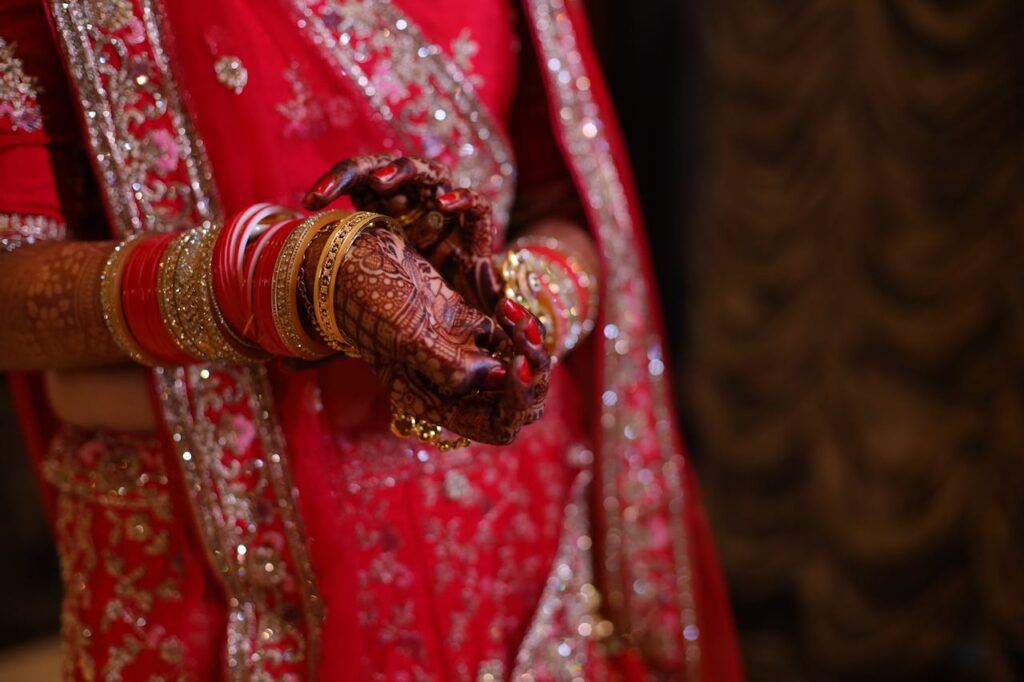 A bride in red and gold jewelry